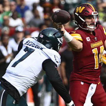 Oct 29, 2023; Landover, Maryland, USA; Washington Commanders quarterback Sam Howell (14) throws as Philadelphia Eagles linebacker Haason Reddick (7) pressures during the first half at FedExField.