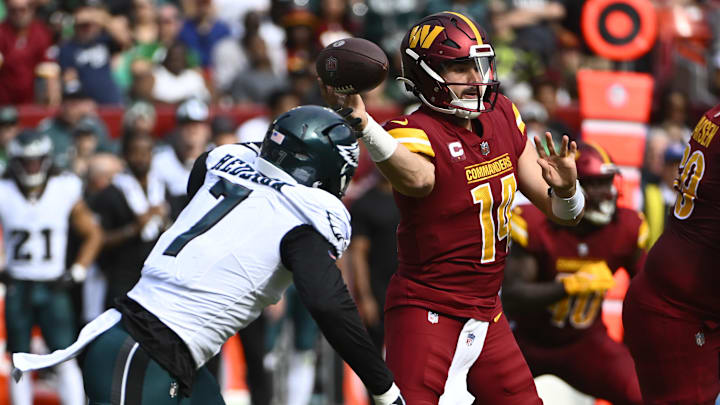 Oct 29, 2023; Landover, Maryland, USA; Washington Commanders quarterback Sam Howell (14) throws as Philadelphia Eagles linebacker Haason Reddick (7) pressures during the first half at FedExField.