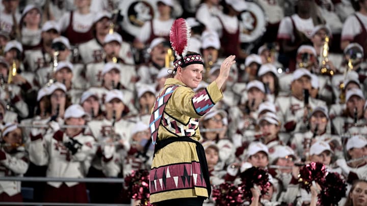 Sep 3, 2023; Orlando, Florida, USA; Florida State Seminoles head drum major John Justice directs the Marching Chiefs during the game against the Louisiana State Tigers at Camping World Stadium. Mandatory Credit: Melina Myers-Imagn Images