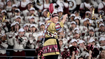 Sep 3, 2023; Orlando, Florida, USA; Florida State Seminoles head drum major John Justice directs the Marching Chiefs during the game against the Louisiana State Tigers at Camping World Stadium. Mandatory Credit: Melina Myers-Imagn Images