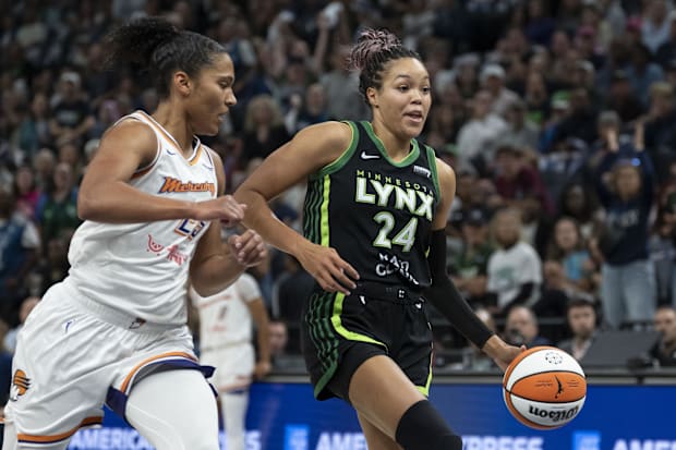 Minnesota Lynx forward Napheesa Collier (24) dribbles past Phoenix Mercury forward Alyssa Thomas