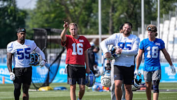 Detroit Lions quarterback Jared Goff (16), center left, talks to linebacker Derrick Barnes (55), left, defensive end Pat O'Connor (95), center right, and wide receiver Isaac TeSlaa (18) after practice during training camp at Meijer Performance Center in Allen Park on Monday, July 21, 2025.