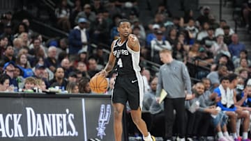 Mar 10, 2025; San Antonio, Texas, USA;  San Antonio Spurs guard De'Aaron Fox (4) points in the first half against the Dallas Mavericks at Frost Bank Center. Mandatory Credit: Daniel Dunn-Imagn Images
