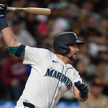 Seattle Mariners catcher Cal Raleigh hits a RBI-single during a game against the San Diego Padres on Wednesday at T-Mobile Park.