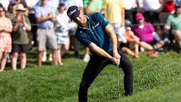 Justin Thomas chips out of the rough on the ninth hole during the third round of the Travelers Championship golf tournament. 