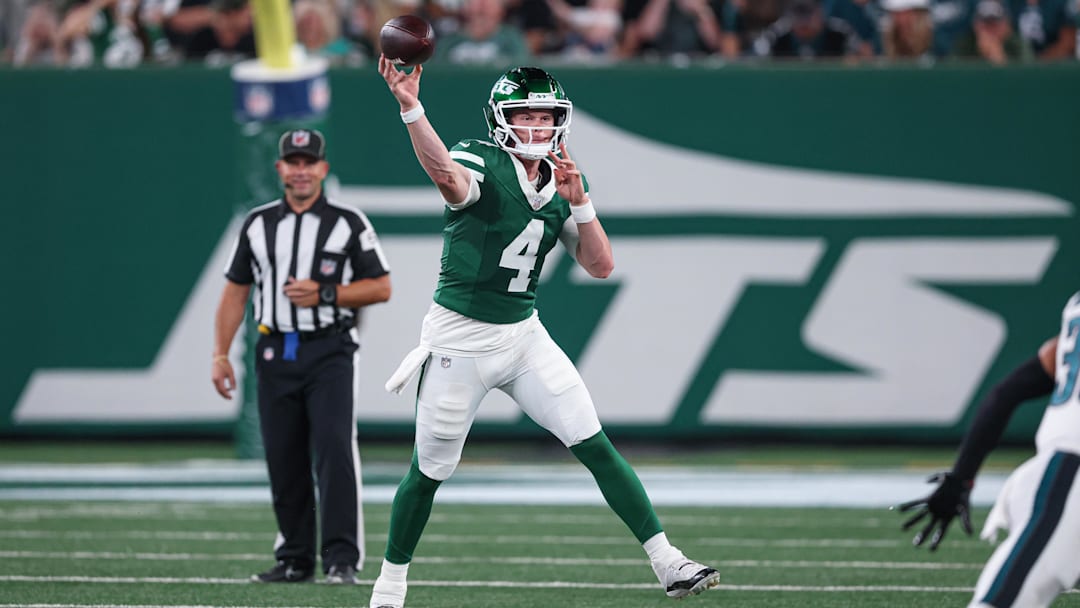 Aug 22, 2025; East Rutherford, New Jersey, USA; New York Jets quarterback Brady Cook (4) throws a pass during the first half against the Philadelphia Eagles at MetLife Stadium. Mandatory Credit: Vincent Carchietta-Imagn Images