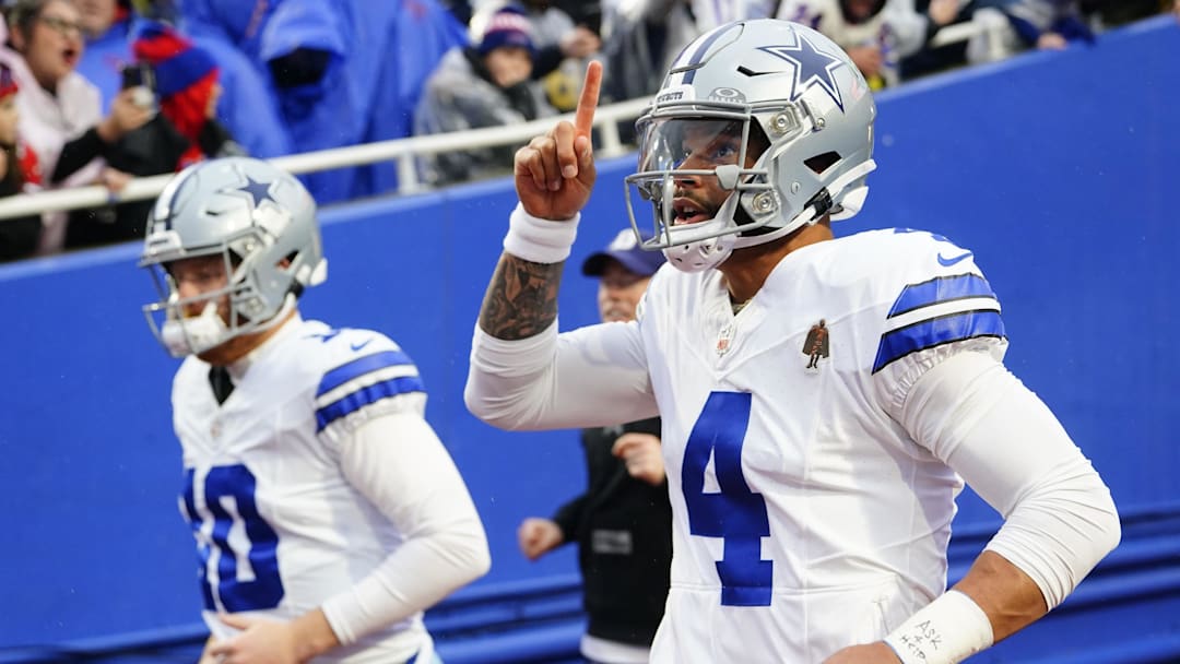 Dec 17, 2023; Orchard Park, New York, USA; Dallas Cowboys quarterback Cooper Rush (10) and quarterback Dak Prescott (4) take the field before the game against the Buffalo Bills at Highmark Stadium.