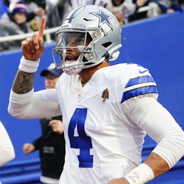 Dallas Cowboys quarterback Dak Prescott and Cooper Rush take the field before the game against the Buffalo Bills.