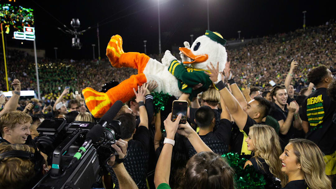 The Oregon Ducks surfs the crowd after the football team defeated Ohio State at Autzen Stadium Saturday, Oct. 12, 2024.