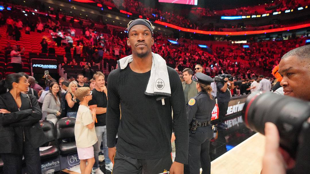 Jan 19, 2025; Miami, Florida, USA;  Miami Heat forward Jimmy Butler (22) walks off the court after greeting court-side friends following the victory over the San Antonio Spurs at Kaseya Center. Mandatory Credit: Jim Rassol-Imagn Images