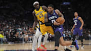 Feb 12, 2024; Charlotte, North Carolina, USA; Charlotte Hornets forward Miles Bridges (0) drives to the basket guarded by Indiana Pacers forward Pascal Siakam (43) during the second half at Spectrum Center. Mandatory Credit: Jim Dedmon-Imagn Images