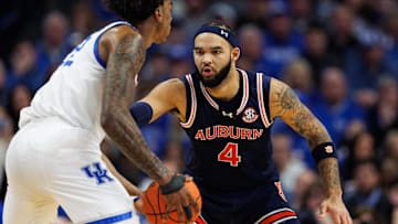 Mar 1, 2025; Lexington, Kentucky, USA; Auburn Tigers forward Johni Broome (4) guards Kentucky Wildcats center Amari Williams (22) during the first half at Rupp Arena at Central Bank Center. Mandatory Credit: Jordan Prather-Imagn Images