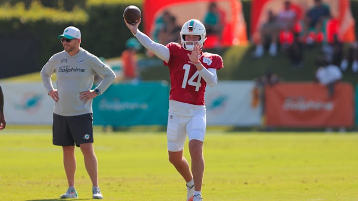 Jul 29, 2025; Miami Gardens, FL, USA; Miami Dolphins quarterback Quinn Ewers (14) throws the football during training camp at Baptist Health Training Complex. Mandatory Credit: Sam Navarro-Imagn Images