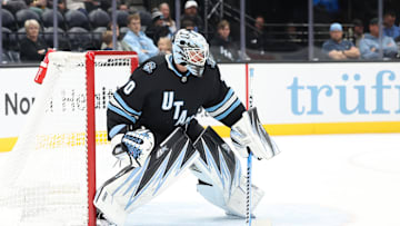 Oct 24, 2024; Salt Lake City, Utah, USA; Utah Hockey Club goaltender Karel Vejmelka (70) clears the puck against the Colorado Avalanche during the third period at Delta Center. Mandatory Credit: Rob Gray-Imagn Images