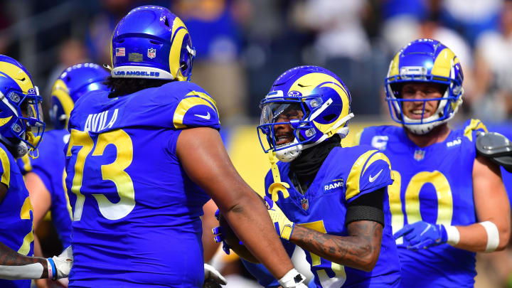 Oct 22, 2023; Inglewood, California, USA; Los Angeles Rams wide receiver Tutu Atwell (5) celebrates his touchdown scored against the Pittsburgh Steelers with guard Steve Avila (73) and wide receiver Cooper Kupp (10)  during the first half at SoFi Stadium. Mandatory Credit: Gary A. Vasquez-USA TODAY Sports