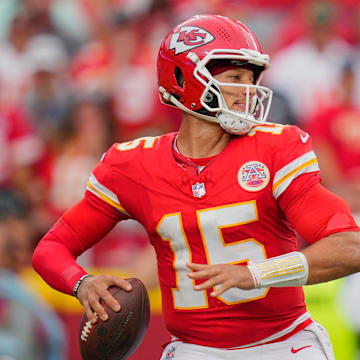 Sep 14, 2025; Kansas City, Missouri, USA; Kansas City Chiefs quarterback Patrick Mahomes (15) passes the ball against the Philadelphia Eagles during the fourth quarter of the game at GEHA Field at Arrowhead Stadium.  