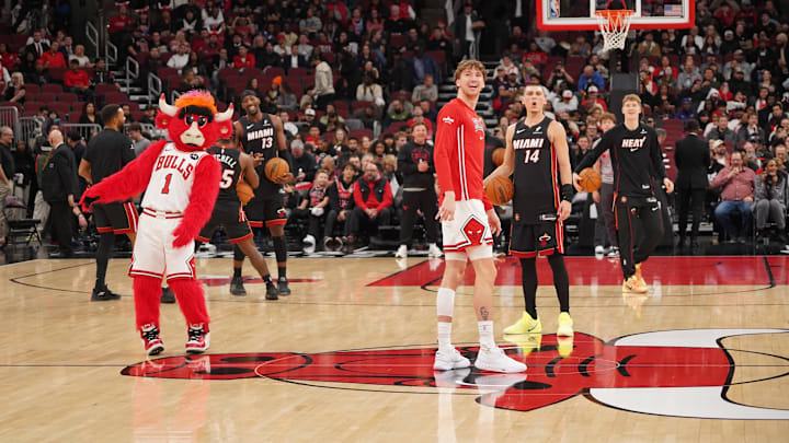 Tyler Herro and Benny the Bull killed some time during the condensation delay at the United Center. Tyler Herro and Benny the Bull killed some time during the condensation delay at the United Center.