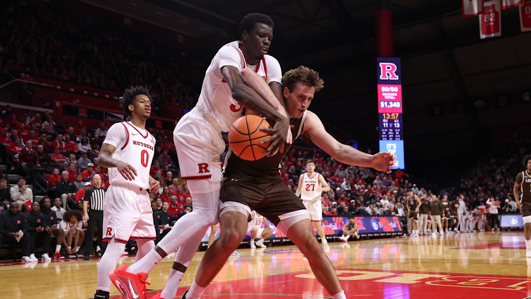 Nov 14, 2025; Piscataway, New Jersey, USA; Lehigh Mountain Hawks forward Hank Alvey (35) goes to the basket as Rutgers Scarlet Knights center Baye Fall (32) defends during the first half at Jersey Mike's Arena. Mandatory Credit: Vincent Carchietta-Imagn Images