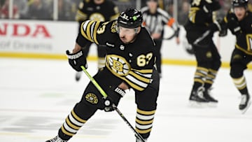 May 17, 2024; Boston, Massachusetts, USA; Boston Bruins left wing Brad Marchand (63) controls the puck during the third period in game six of the second round of the 2024 Stanley Cup Playoffs against the Florida Panthers at TD Garden. Mandatory Credit: Bob DeChiara-Imagn Images