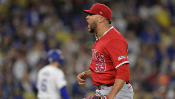 Jun 21, 2024; Los Angeles, California, USA;  Los Angeles Angels relief pitcher Carlos Estevez (53) reacts after striking out Los Angeles Dodgers second baseman Gavin Lux (9) in the 10th inning earning a save in the game at Dodger Stadium. 