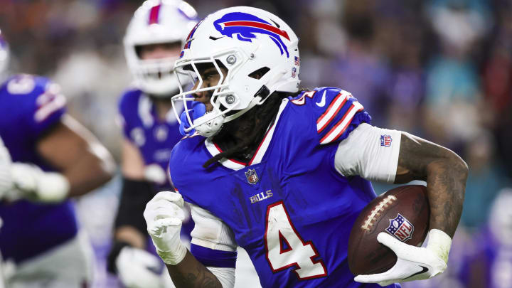 Jan 7, 2024; Miami Gardens, Florida, USA; Buffalo Bills running back James Cook (4) runs with the football against the Miami Dolphins during the fourth quarter at Hard Rock Stadium. Mandatory Credit: Sam Navarro-USA TODAY Sports