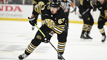 May 17, 2024; Boston, Massachusetts, USA; Boston Bruins left wing Brad Marchand (63) controls the puck during the third period in game six of the second round of the 2024 Stanley Cup Playoffs against the Florida Panthers at TD Garden. Mandatory Credit: Bob DeChiara-Imagn Images