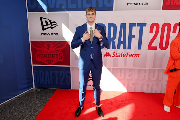Liam McNeeley arrives before the first round of the 2025 NBA Draft