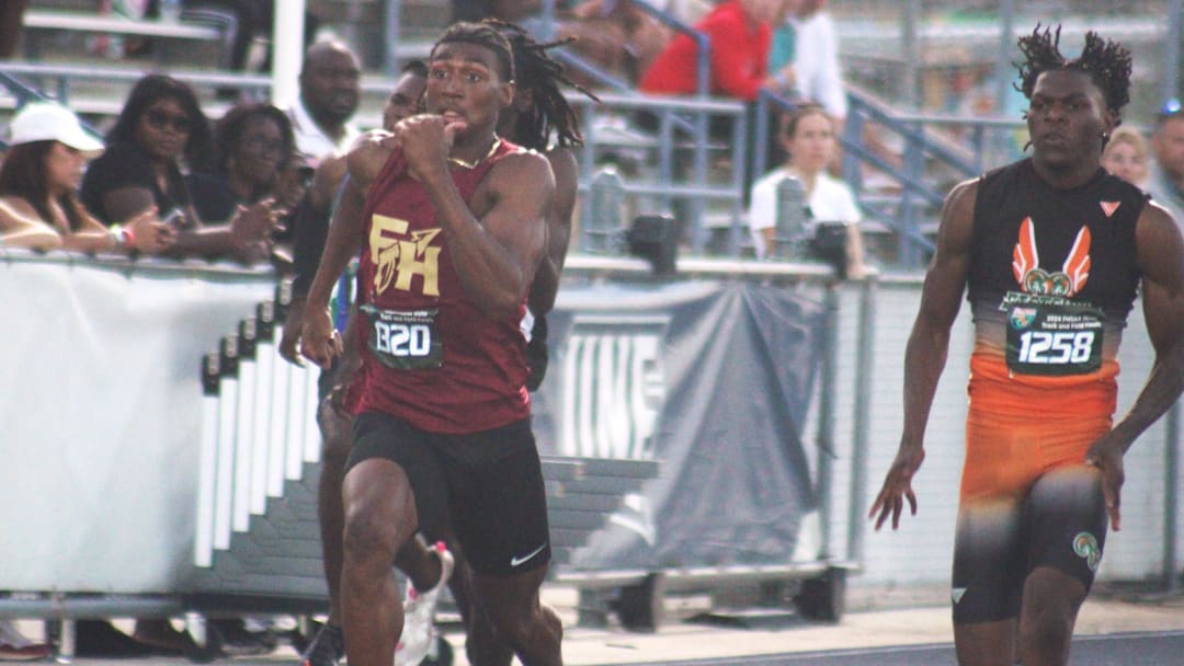 Micahi Danzy (1320) of Florida High and Kennith Martin (1258) of Gainesville Eastside race side-by-side in the boys 200-meter dash during the FHSAA Class 2A high school track and field meet in Jacksonville on May 16, 2024. [Clayton Freeman/Florida Times-Union]