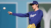 Oct 28, 2025; Los Angeles, California, USA; Los Angeles Dodgers pitcher Roki Sasaki (11) warms up before game four of the 2025 MLB World Series against the Toronto Blue Jays at Dodger Stadium. Mandatory Credit: Kiyoshi Mio-Imagn Images