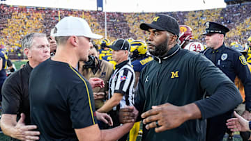 Michigan head coach Sherrone Moore shakes hands with USC head coach Lincoln Riley after 27-24 win at Michigan Stadium in Ann Arbor on Saturday, Sept. 21, 2024.
