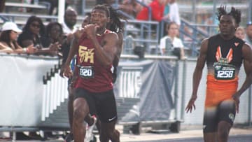 Micahi Danzy (1320) of Florida High and Kennith Martin (1258) of Gainesville Eastside race side-by-side in the boys 200-meter dash during the FHSAA Class 2A high school track and field meet in Jacksonville on May 16, 2024. [Clayton Freeman/Florida Times-Union]