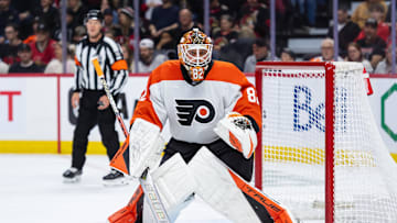 Apr 13, 2025; Ottawa, Ontario, CAN; Philadelphia Flyers goalie Ivan Fedotov (82) follows the puck in the first period against the Ottawa Senators at the Canadian Tire Centre.