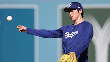 Oct 28, 2025; Los Angeles, California, USA; Los Angeles Dodgers pitcher Roki Sasaki (11) warms up before game four of the 2025 MLB World Series against the Toronto Blue Jays at Dodger Stadium. Mandatory Credit: Kiyoshi Mio-Imagn Images