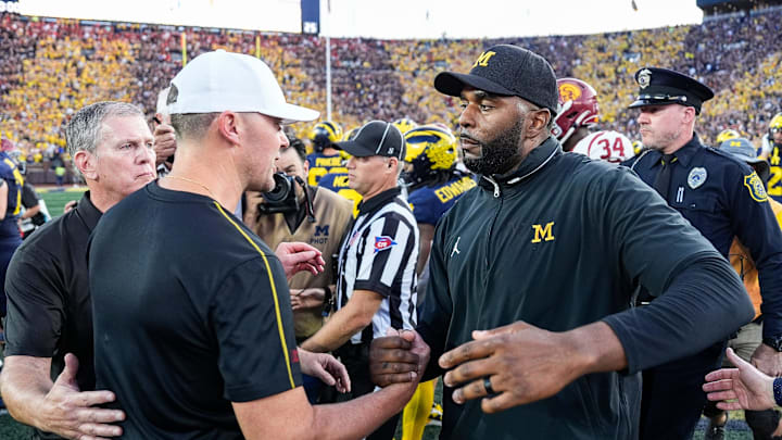 Michigan head coach Sherrone Moore shakes hands with USC head coach Lincoln Riley after 27-24 win at Michigan Stadium in Ann Arbor on Saturday, Sept. 21, 2024.