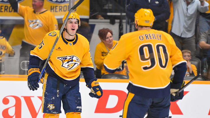 Mar 18, 2025; Nashville, Tennessee, USA;  Nashville Predators defenseman Brady Skjei (76) celebrates his goal with center Ryan O'Reilly (90) against the St. Louis Blues during the second period at Bridgestone Arena. Mandatory Credit: Steve Roberts-Imagn Images