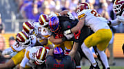 Nov 8, 2025; Fort Worth, Texas, USA; TCU Horned Frogs running back Kevorian Barnes (2) is gang tackled by the Iowa State Cyclones defense during the first half at Amon G. Carter Stadium. Mandatory Credit: Jerome Miron-Imagn Images