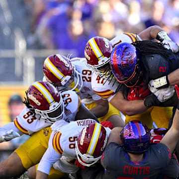 Nov 8, 2025; Fort Worth, Texas, USA; TCU Horned Frogs running back Kevorian Barnes (2) is gang tackled by the Iowa State Cyclones defense during the first half at Amon G. Carter Stadium. Mandatory Credit: Jerome Miron-Imagn Images
