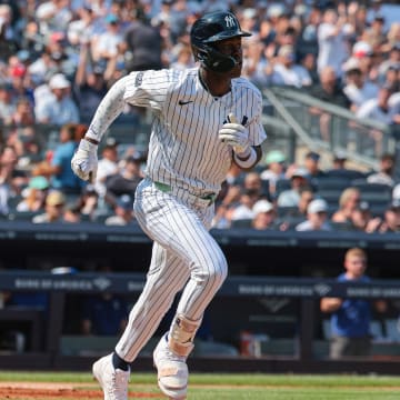 Aug 11, 2024; Bronx, New York, USA; New York Yankees third baseman Jazz Chisholm Jr. (13) singles during the sixth inning against the Texas Rangers at Yankee Stadium. Mandatory Credit: Vincent Carchietta-USA TODAY Sports