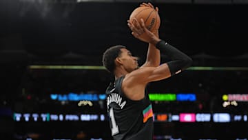 Nov 12, 2025; San Antonio, Texas, USA; San Antonio Spurs forward Victor Wembanyama (1) shoots in the first half against the Golden State Warriors at Frost Bank Center.