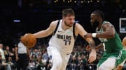 Jun 17, 2024; Boston, Massachusetts, USA; Dallas Mavericks guard Luka Doncic (77) dribbles the ball against Boston Celtics guard Jaylen Brown (7) during the second quarter in game five of the 2024 NBA Finals at TD Garden. Mandatory Credit: Peter Casey-USA TODAY Sports