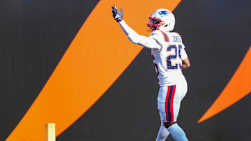 New England Patriots cornerback Marcus Jones (25) celebrates a pick-6 in the second quarter of the NFL Week 12 game between the Cincinnati Bengals and the New England Patriots at Paycor Stadium in downtown Cincinnati on Sunday, Nov. 23, 2025.