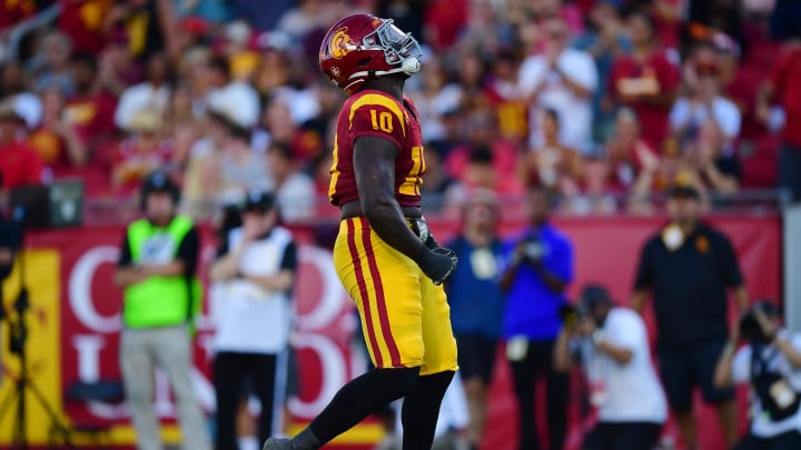 Aug 26, 2023; Los Angeles, California, USA; Southern California Trojans defensive end Jamil Muhammad (10) reacts after sacking San Jose State Spartans quarterback Chevan Cordeiro (2) during the first half at Los Angeles Memorial Coliseum. Mandatory Credit: Gary A. Vasquez-USA TODAY Sports