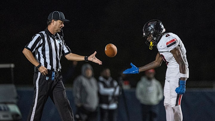 Miami Southridge receiver James Gatewood gives the ball to the official after scoring a touchdown against West Boca in the state semifinal game on December 6, 2024, in Boca Raton, Florida.