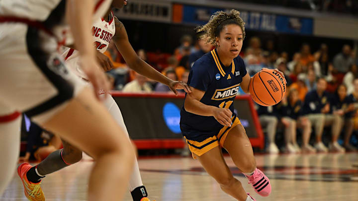 Mar 23, 2024; Raleigh, North Carolina, USA; Chattanooga Lady Mocs guard Caia Elisaldez (11) dribbles towards the lane in the first round of the 2024 NCAA Women's Tournament at James T. Valvano Arena at William Neal Reynolds. Mandatory Credit: William Howard-Imagn Images