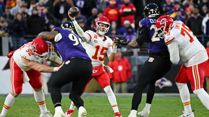 Jan 28, 2024; Baltimore, Maryland, USA; Kansas City Chiefs quarterback Patrick Mahomes (15) passes the ball against the Baltimore Ravens during the second half in the AFC Championship football game at M&T Bank Stadium. 