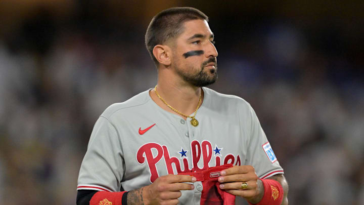 Nick Castellanos (8) returns to the dugout after an out against the Los Angeles Dodgers at Dodger Stadium.