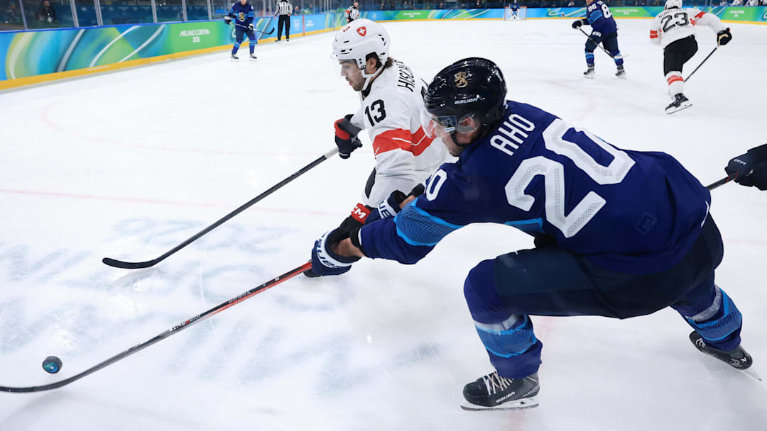 Feb 18, 2026; Milan, Italy; Nico Hischier of Switzerland in action with Sebastian Aho of Finland in a men's ice hockey quarterfinal during the Milano Cortina 2026 Olympic Winter Games at Milano Rho Ice Hockey Arena. Mandatory Credit: Katie Stratman-Imagn Images Feb 18, 2026; Milan, Italy; Nico Hischier of Switzerland in action with Sebastian Aho of Finland in a men's ice hockey quarterfinal during the Milano Cortina 2026 Olympic Winter Games at Milano Rho Ice Hockey Arena. Mandatory Credit: Katie Stratman-Imagn Images