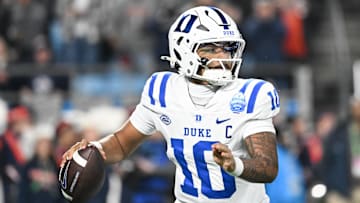 Dec 6, 2025; Charlotte, NC, USA; Duke Blue Devils quarterback Darian Mensah (10) looks to throw in the second quarter against the Virginia Cavaliers during the 2025 ACC Championship game at Bank of America Stadium. Mandatory Credit: Bob Donnan-Imagn Images