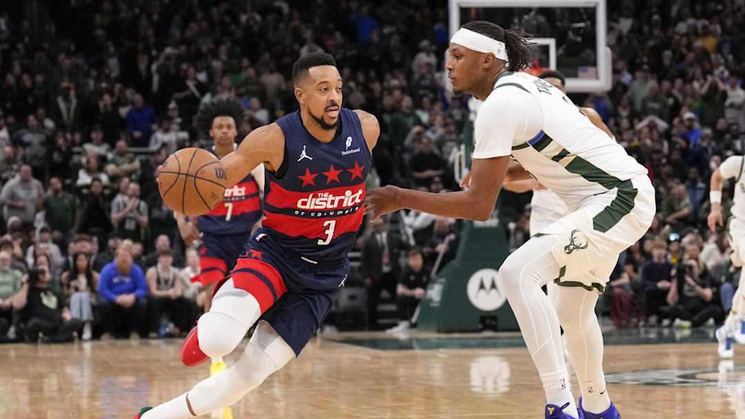 Dec 31, 2025; Milwaukee, Wisconsin, USA; Washington Wizards guard CJ McCollum (3) drives for the basket against Milwaukee Bucks center Myles Turner (3) during the fourth quarter at Fiserv Forum. Mandatory Credit: Jeff Hanisch-Imagn Images Dec 31, 2025; Milwaukee, Wisconsin, USA; Washington Wizards guard CJ McCollum (3) drives for the basket against Milwaukee Bucks center Myles Turner (3) during the fourth quarter at Fiserv Forum. Mandatory Credit: Jeff Hanisch-Imagn Images