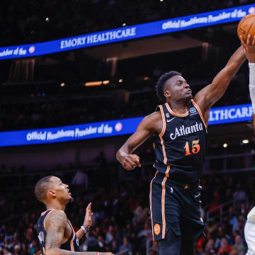 Mar 17, 2023; Atlanta, Georgia, USA; Atlanta Hawks center Clint Capela (15) blocks the shot of Golden State Warriors forward Kevon Looney (5) in the second half at State Farm Arena. Mandatory Credit: Brett Davis-USA TODAY Sports